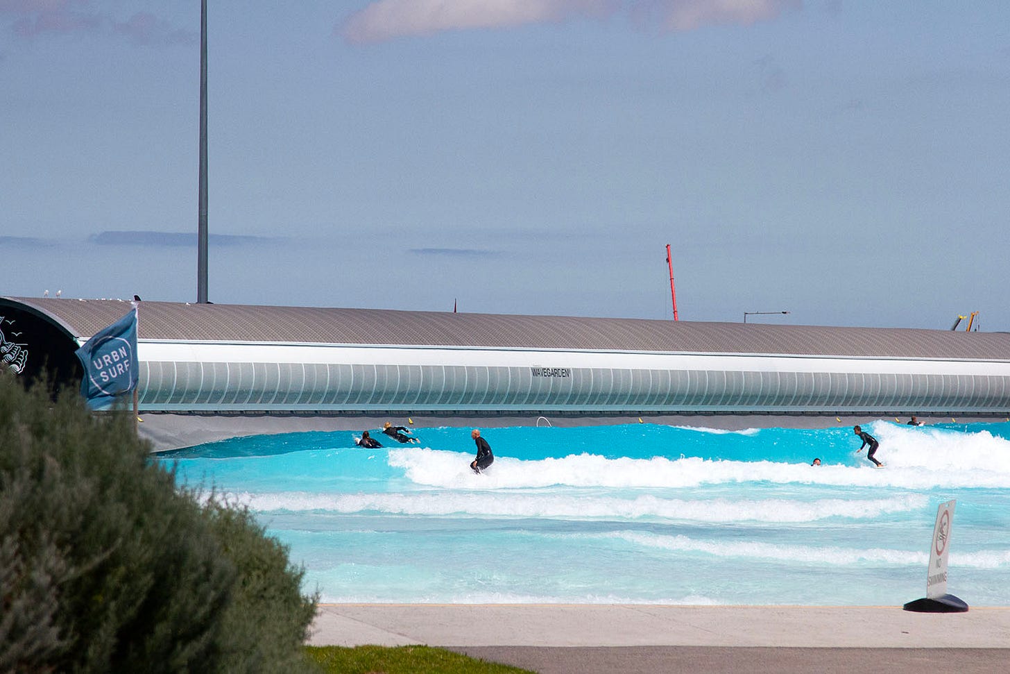 Surfers at URBNSURF in Melbourne.