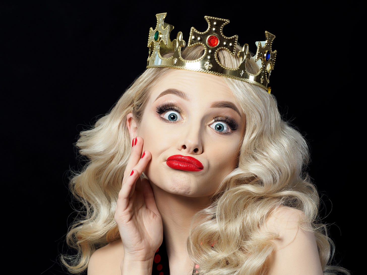 Beautiful blonde model wearing a princess crown.