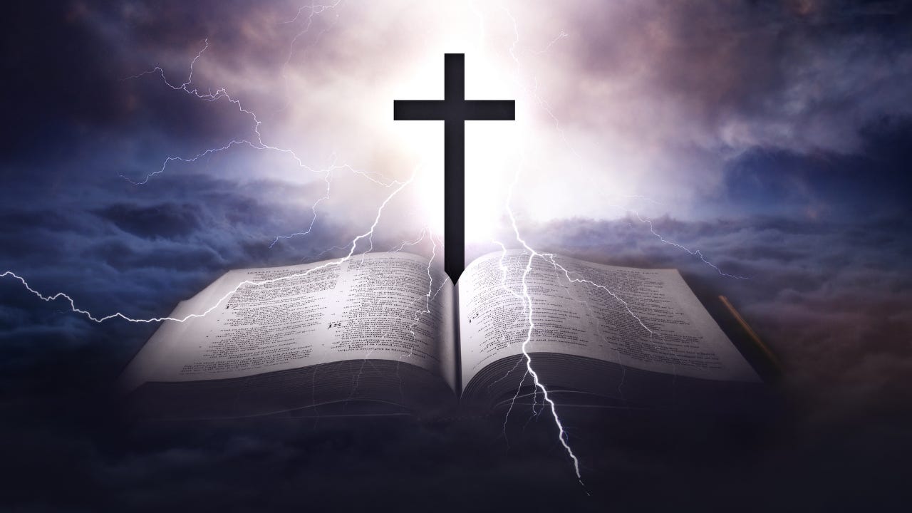A cross sitting on the Bible surrounded by lightening. 