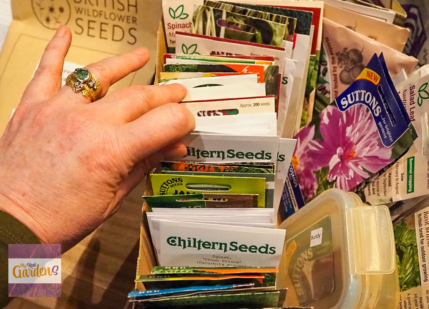 Thumbing through seeds in a box