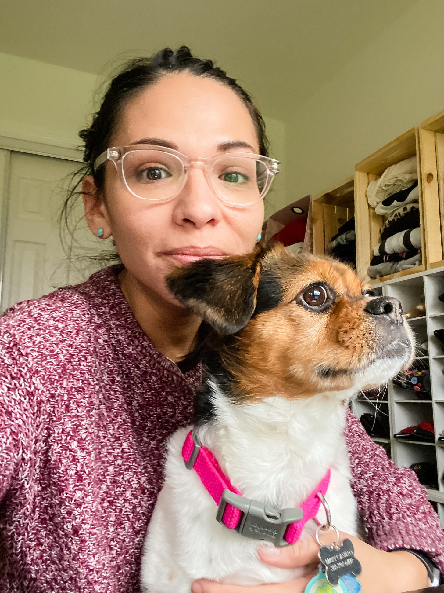 Selfie of woman and her dog looking out the window