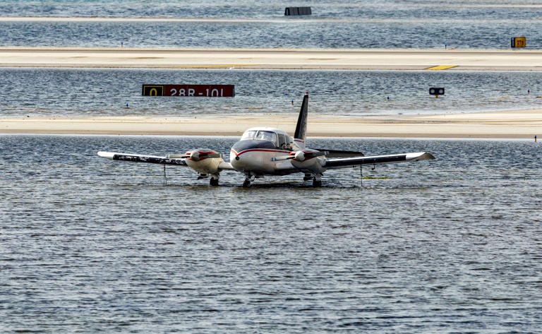 April 13 A small plane parked next to flooded runways at Fort Lauderdale-Hollywood International Airport.