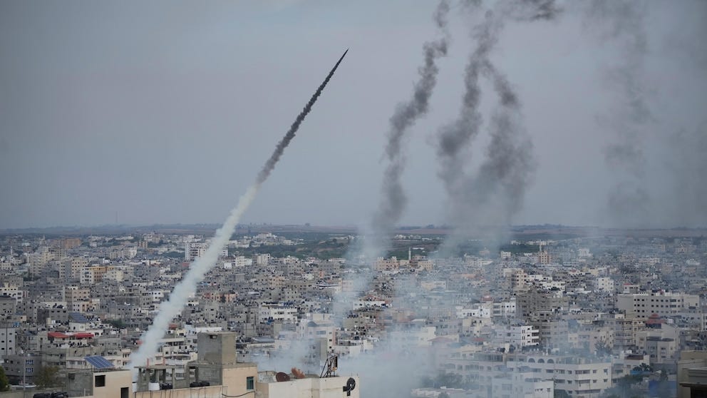 Rockets are launched by Palestinian militants from the Gaza Strip towards Israel, in Gaza, Saturday, Oct. 7, 2023. The militant Hamas rulers of the Gaza Strip carried out an unprecedented, multi-front attack on Israel at daybreak Saturday, firing thousands of rockets as dozens of Hamas fighters infiltrated the heavily fortified border in several locations by air, land, and sea and catching the country off-guard on a major holiday. (AP Photo/Hatem Moussa)