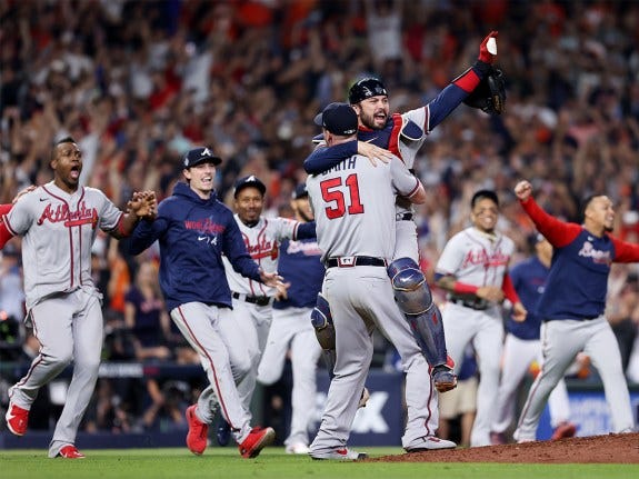 Will Smith #51 and Travis d'Arnaud #16 of the Atlanta Braves celebrate