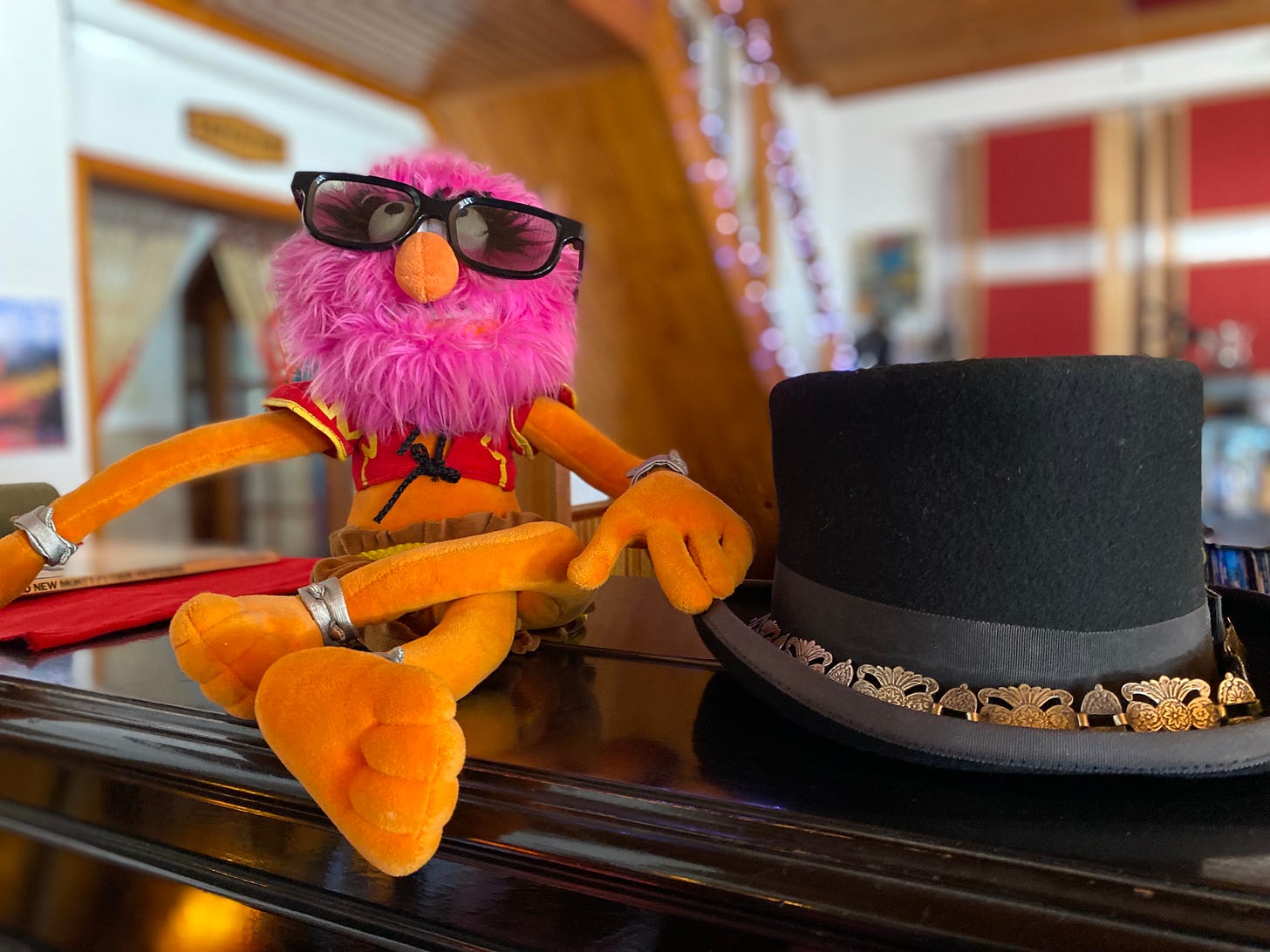 Animal from the Muppets wearing sunglasses sat next to a top hat in the Supertone studio, Samora Correia, Portugal