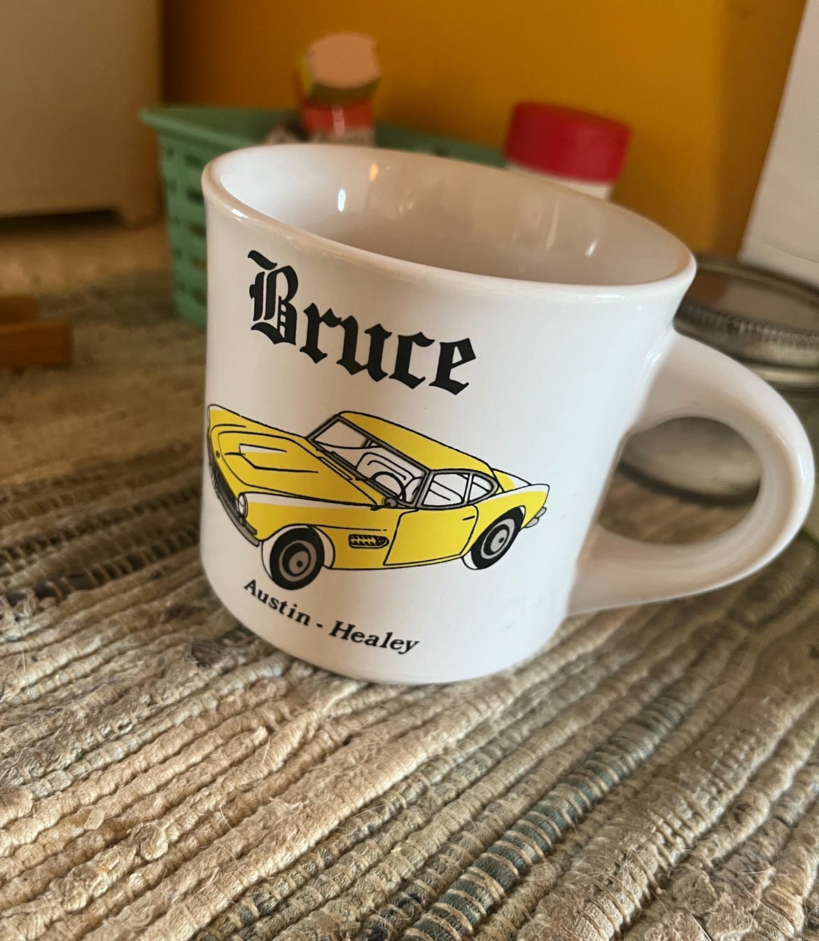 A similar mug, this one with the name "Bruce" and the image of a racecar. 
