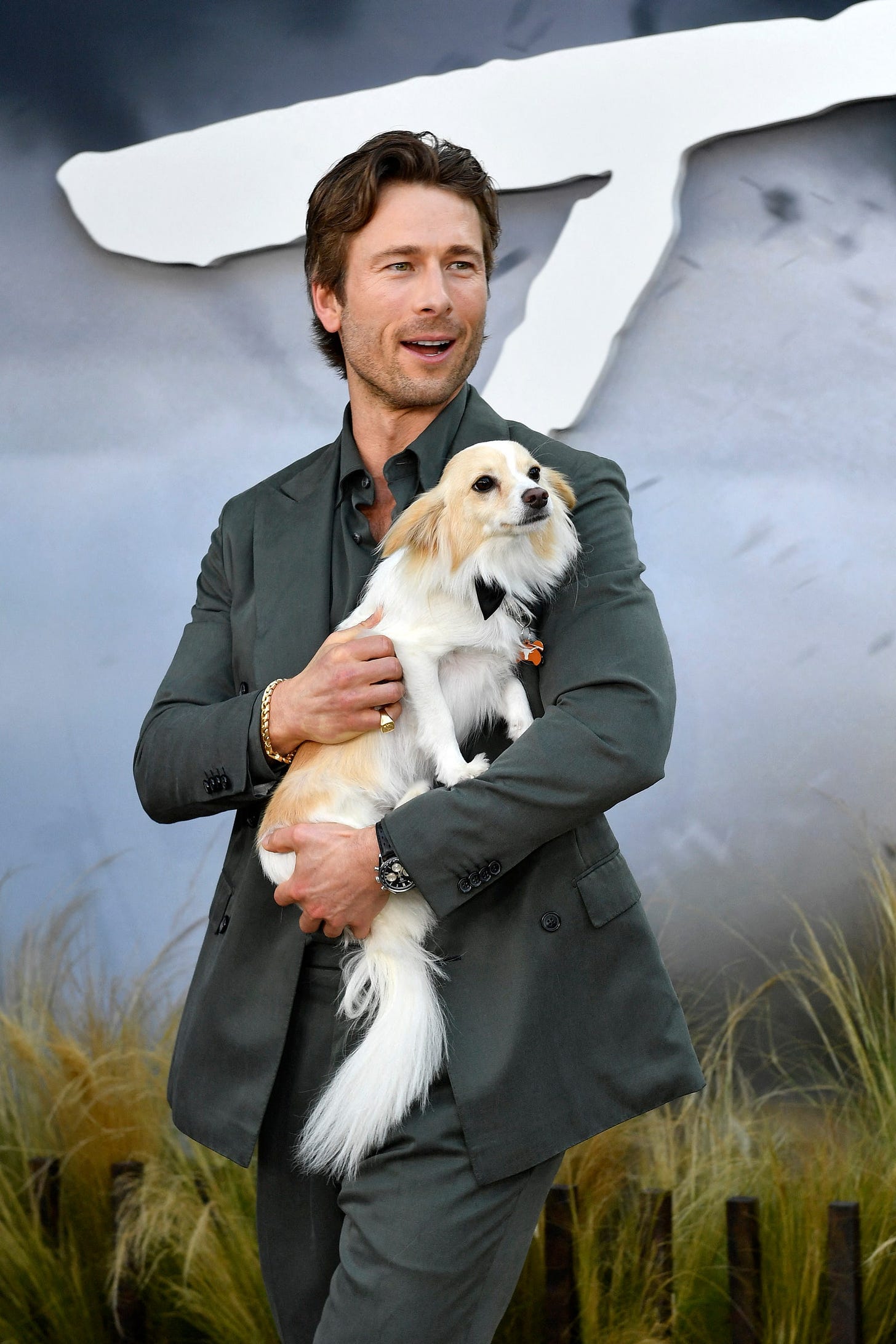 Glen Powell and his dog Brisket attend Universal's Twisters premiere at the Regency Village theatre in Los Angeles July...