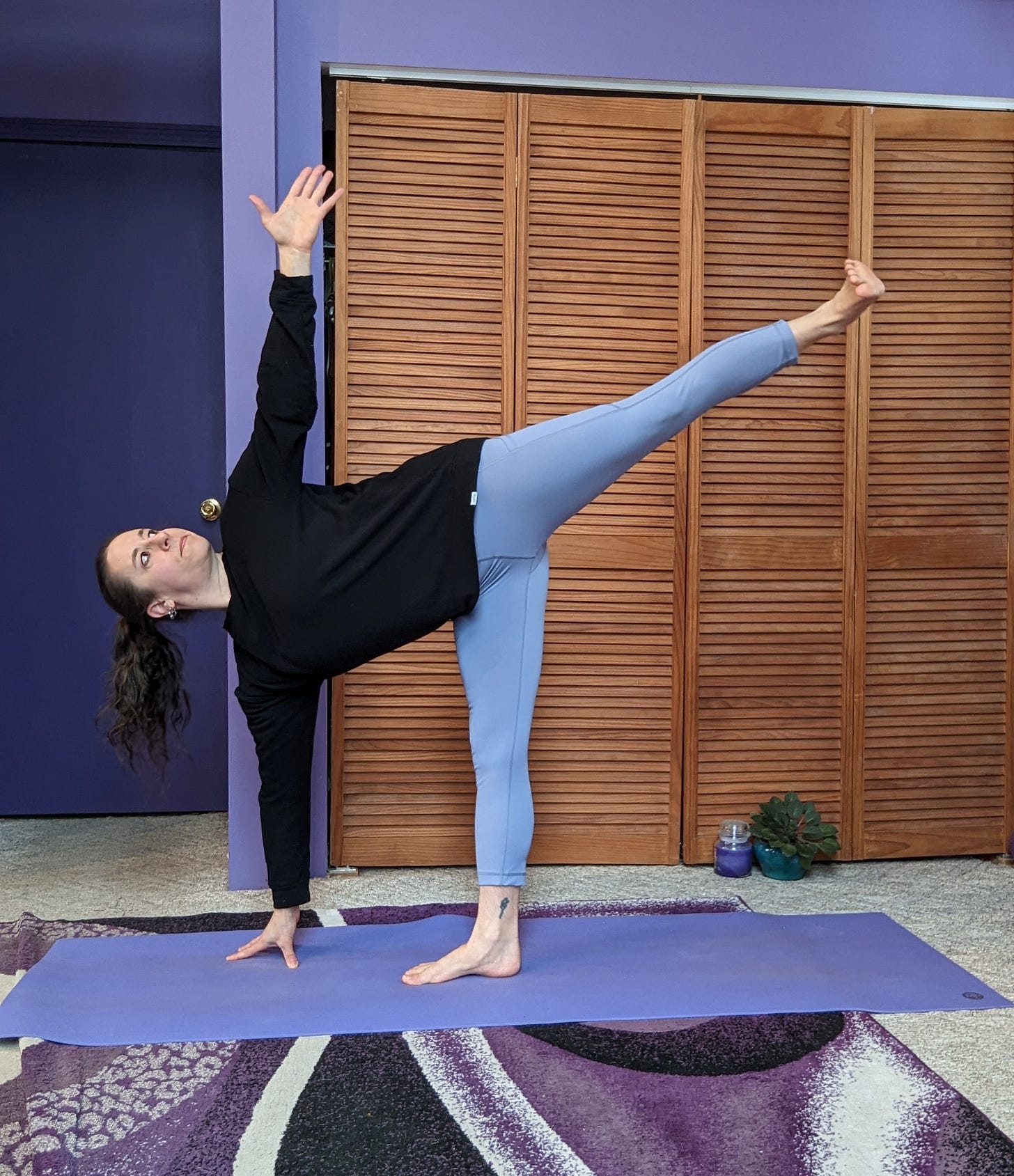 A demonstration of Ardha Chandrasana, or Half Moon pose