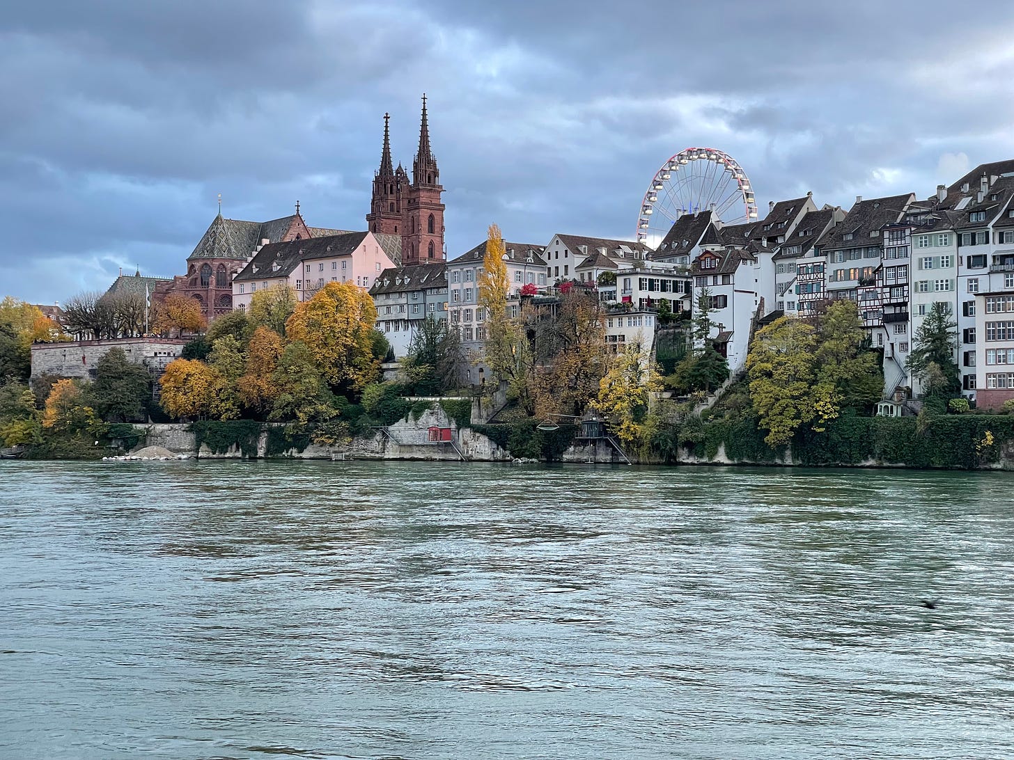 The Rhine and Basel Münster with Ferris wheel.