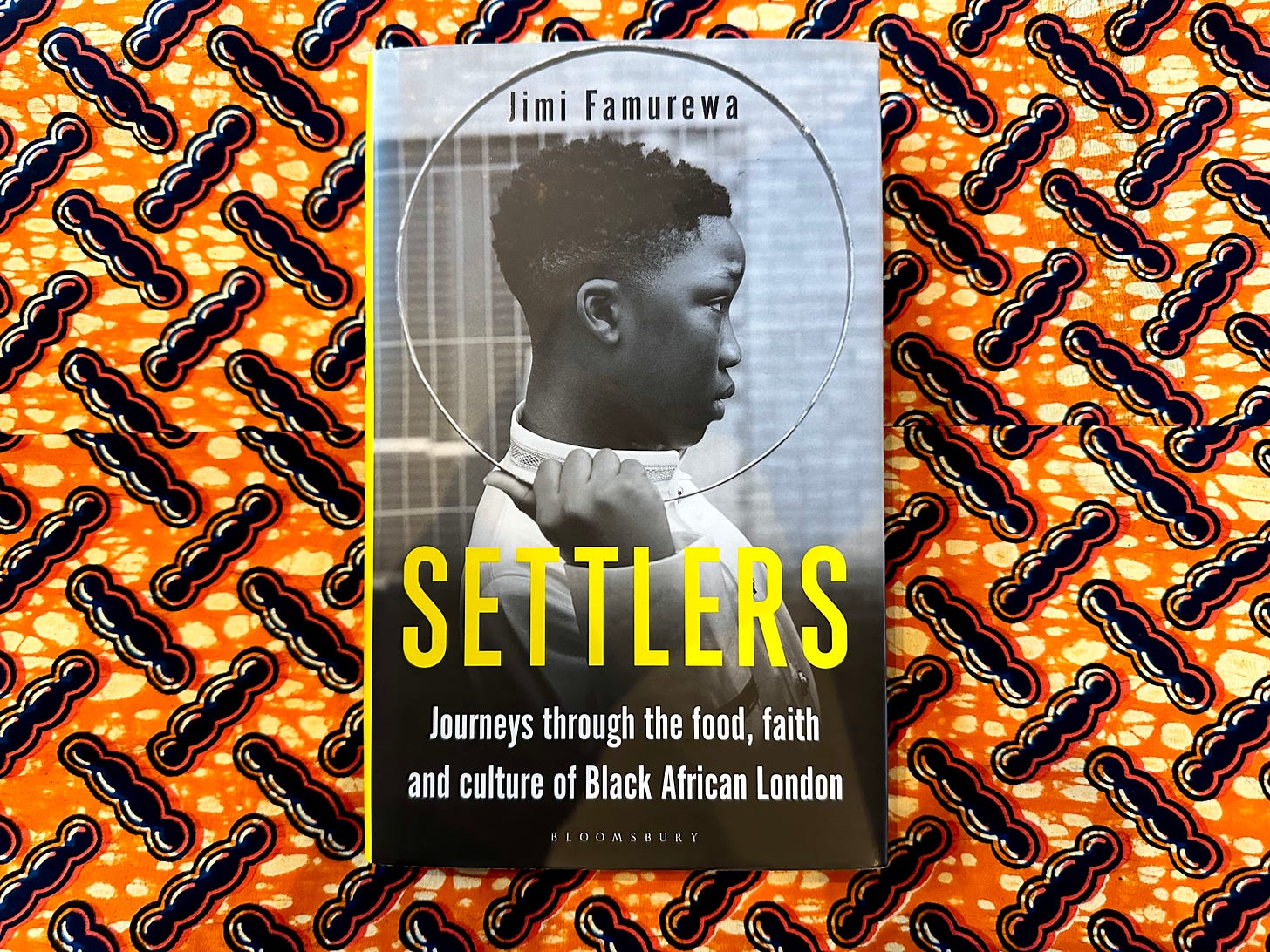 Picture of a book titled "Settlers", by Jimi Famurewa, on a vibrant orange and black African wax print cloth. The cover shows a young Black African boy in profile holding a circular metal hoop that frames his head. The books titles fills the bottom third of the cover.