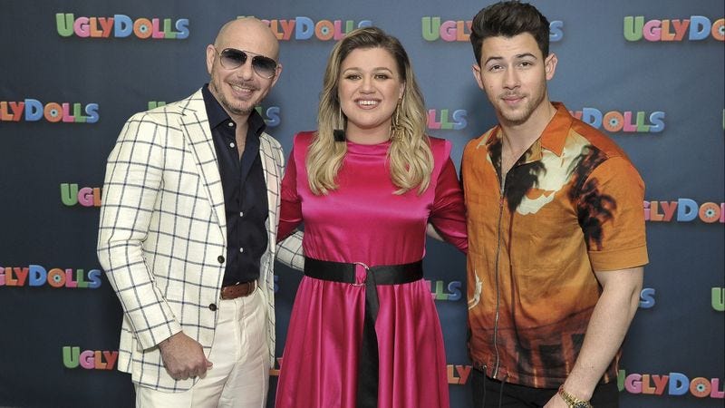 kelly clarkson with nick jonas and pitbull at uglydolls premiere