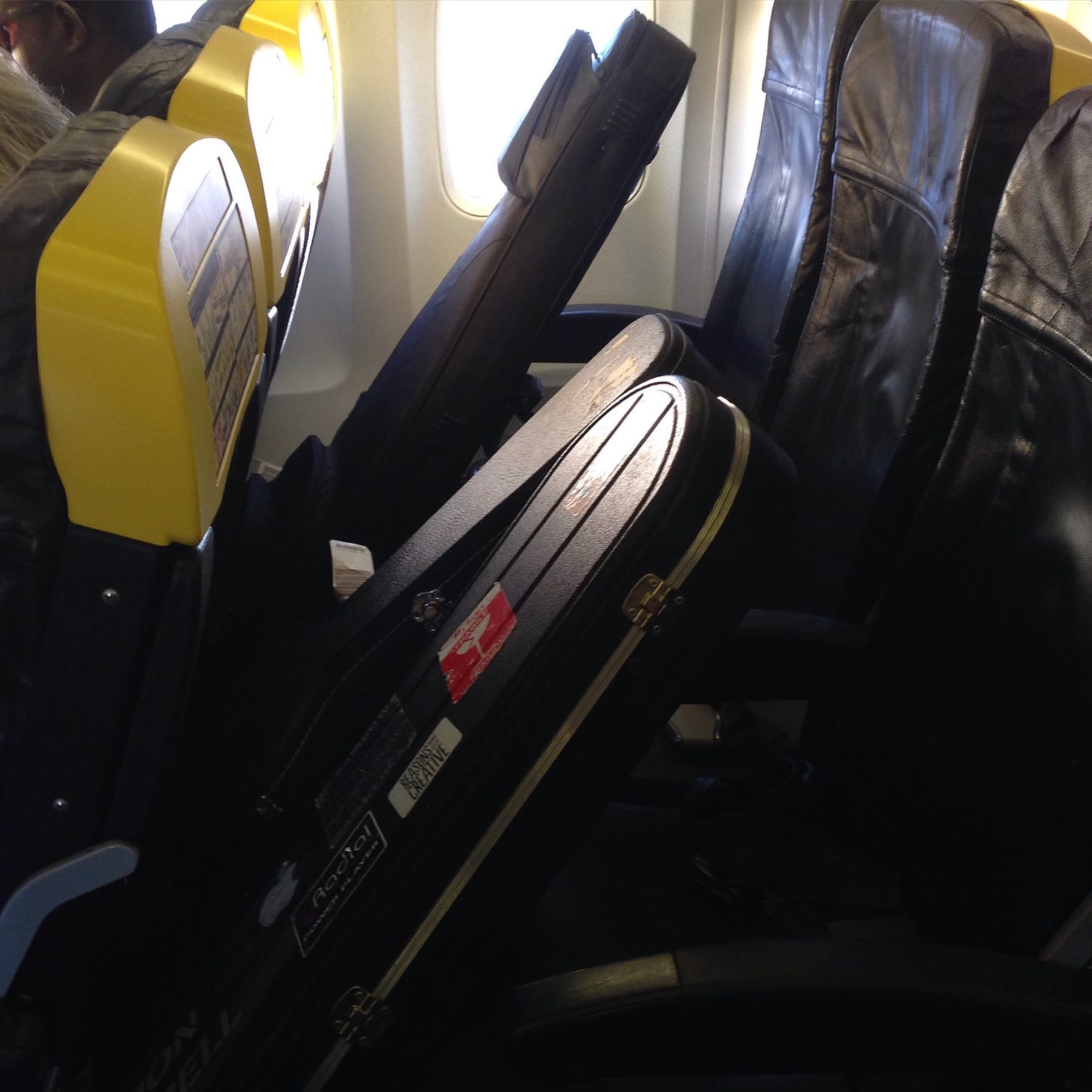 Bass guitars taking the window seat on a Ryanair flight