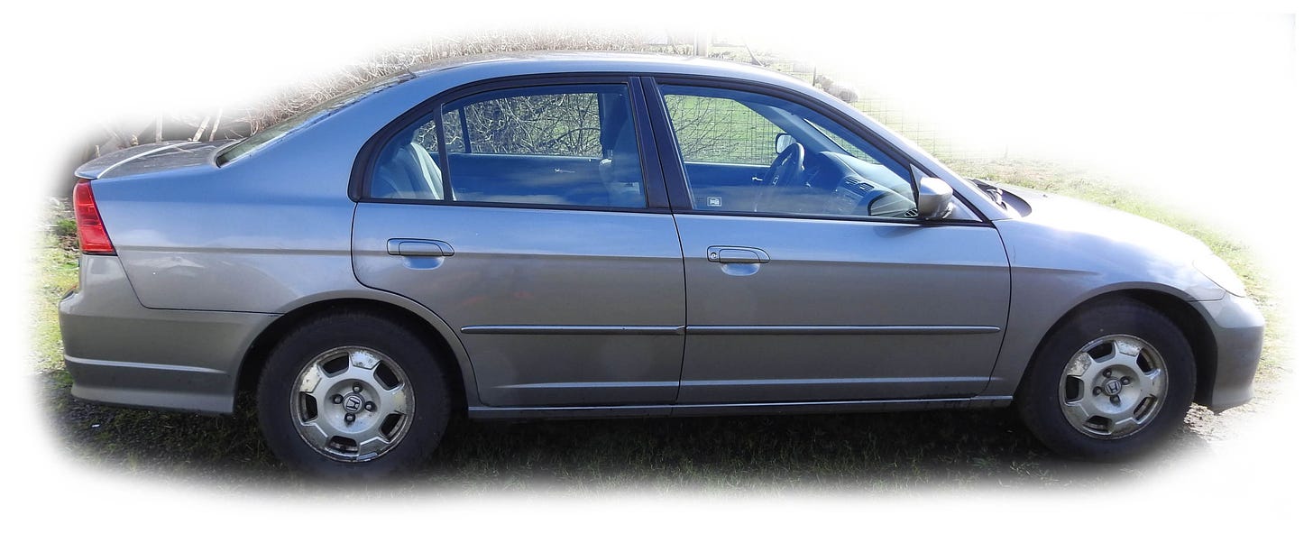Photo of a gray Honda Civic sedan.