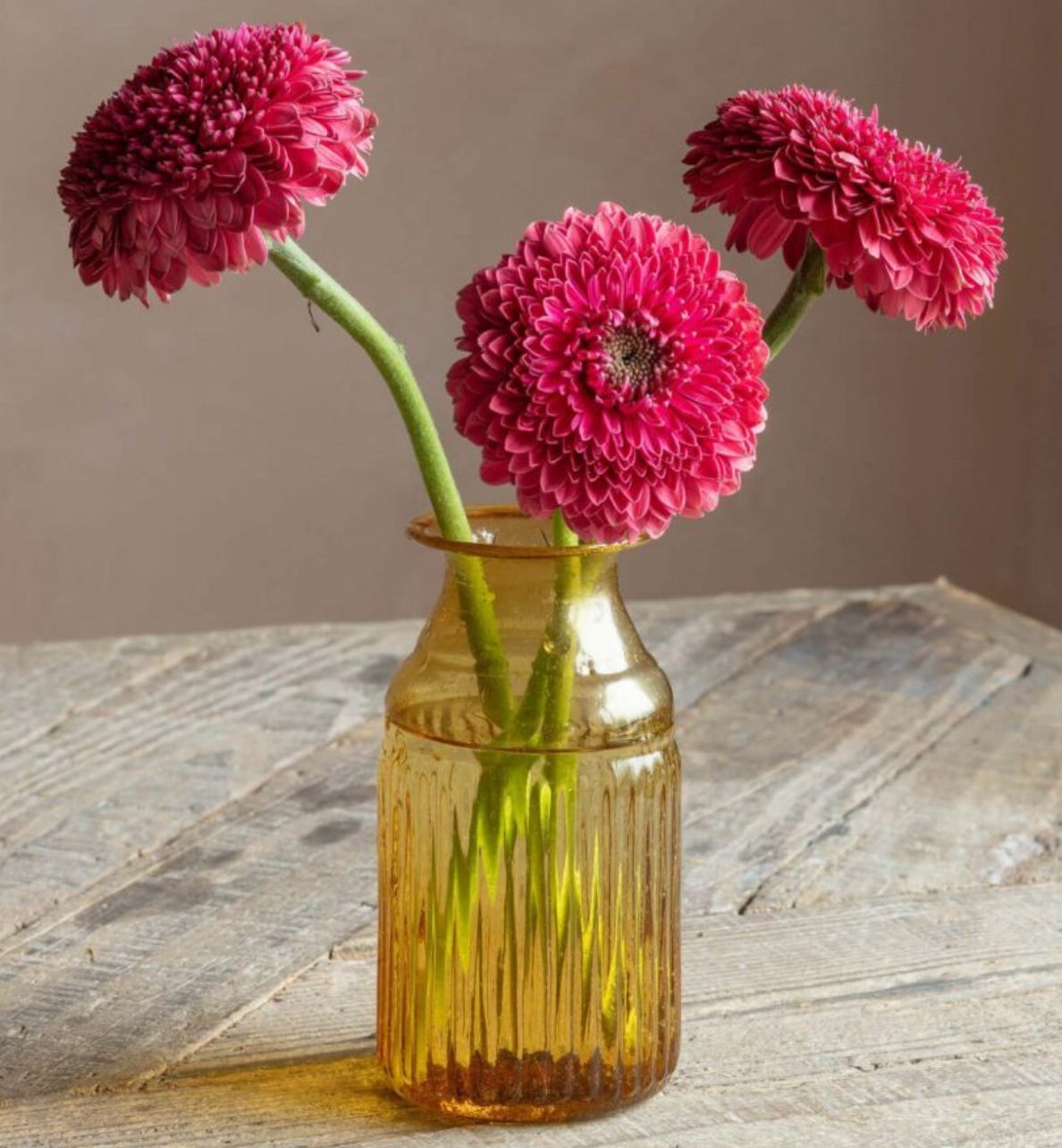 a yellow textured bubble glass bud vase