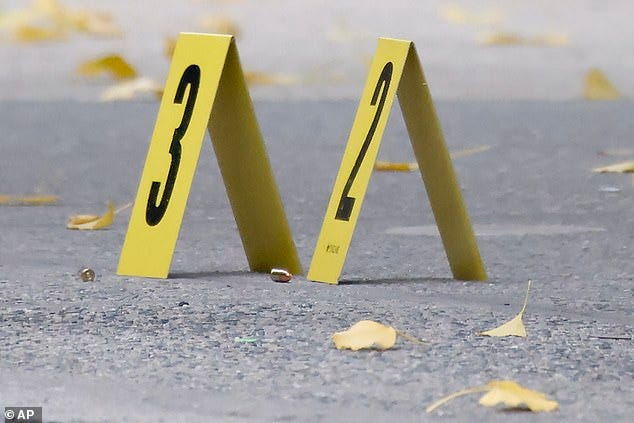 Bullets lie on the sidewalk at the scene outside the Hilton Hotel in midtown Manhattan where Brian Thompson, the CEO of UnitedHealthcare, was fatally shot, Wednesday, December 4