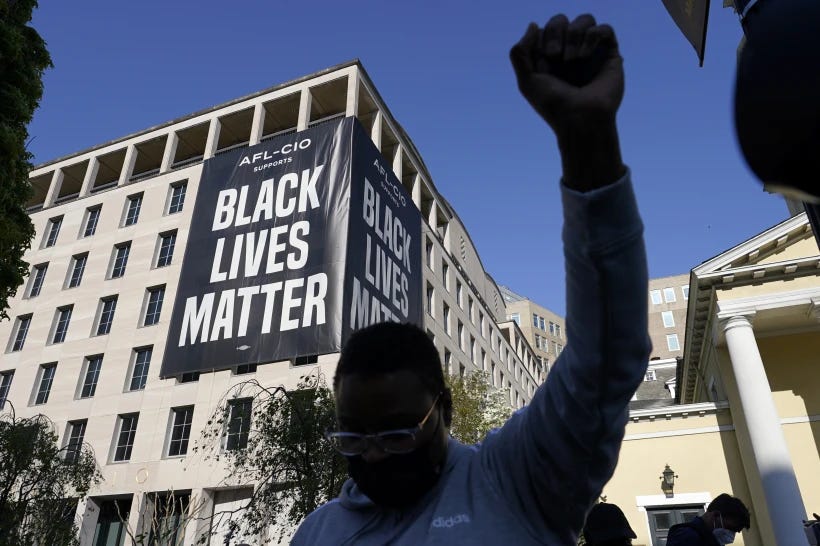 FILE - A person holds their fist in the air, April 20, 2021, in Washington at Black Lives Matter Plaza near the White House after the verdict in the murder trial against former Minneapolis police officer Derek Chauvin was announced in Minneapolis. On Tuesday, June 27, 2023, a California judge dismissed a civil lawsuit that grassroots racial justice activists from around the U.S. brought last summer against a foundation with stewardship of the Black Lives Matter movement’s charitable endowment worth tens of millions of dollars. (AP Photo/Alex Brandon, File)