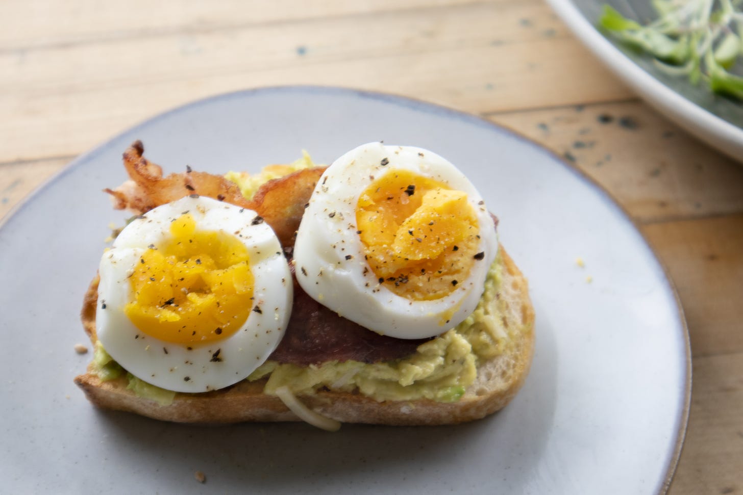 avocado toast with bacon and eggs