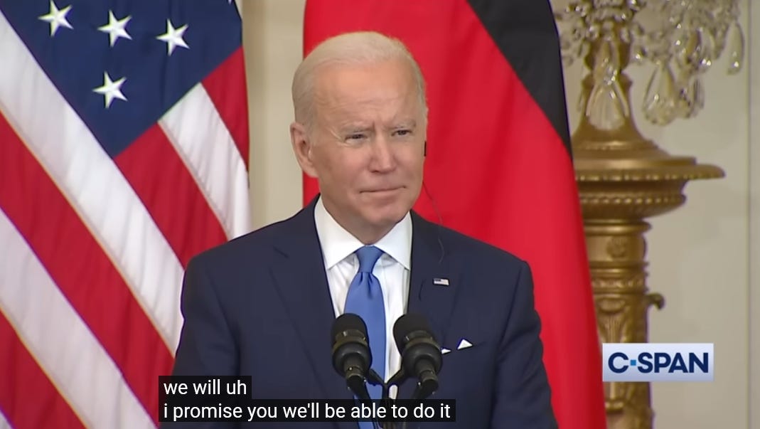 US President Joe Biden at a press conference with subtitles that read "we will uh i promise you we'll be able to do it"
