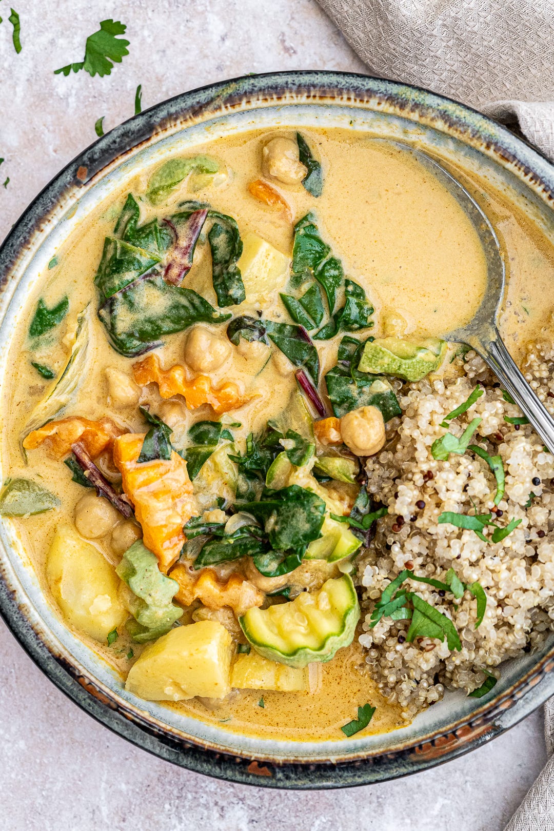 Vegetable curry served with quinoa