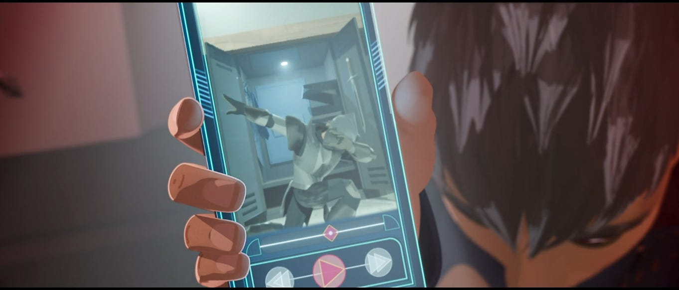 Screenshot from the movie showing the Squire demonstrating the video of himself on his phone, caught on the frame of him dabbing in Ballister's armor.