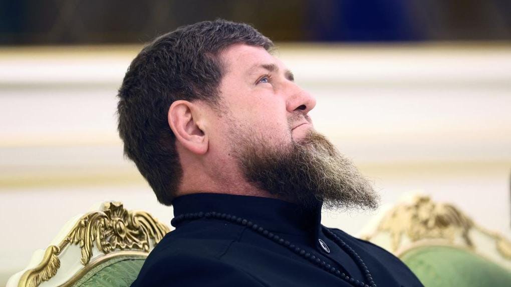 Chechnya leader Ramzan Kadyrov attending a meeting in December 2023, showing a prominent beard and sitting on a golden and green velvet chair.