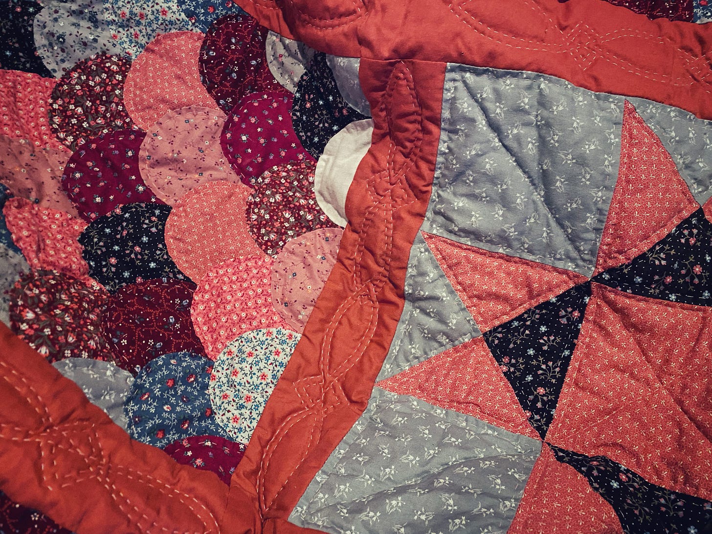 A close up photo of a patchwork quilt.