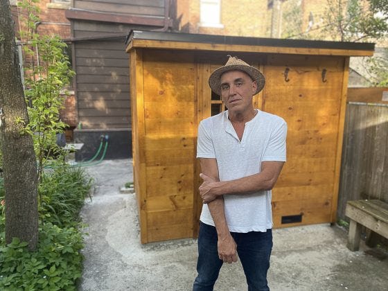 Frank in front of his Toronto home sauna