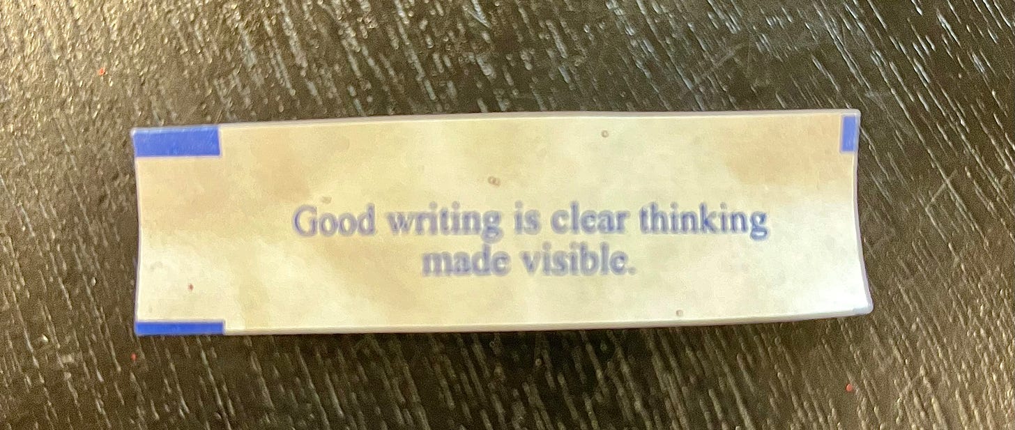 A fortune cookie fortune reading, "Good writing is clear thinking made visible."