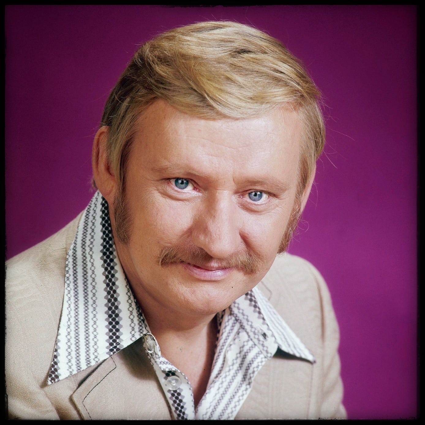 Reuben Kincaid: Partridge Family manager with piercing blue eyes, blond moustache, and wide black and white striped open collar