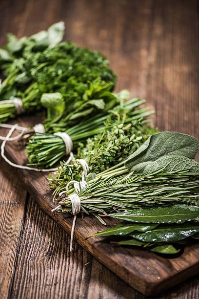 Freshly cut herbs Freshly cut herbs on wooden kitchen table fresh herbs stock pictures, royalty-free photos & images