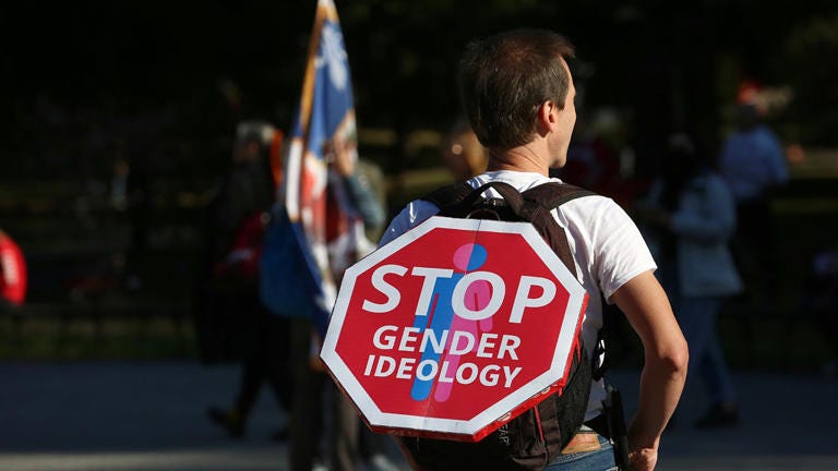 A protester carries a sign that reads, "Stop Gender Ideology" at Queens Park in Toronto on Sept. 20, 2023. Mert Alper Dervis/Anadolu Agency via Getty Images