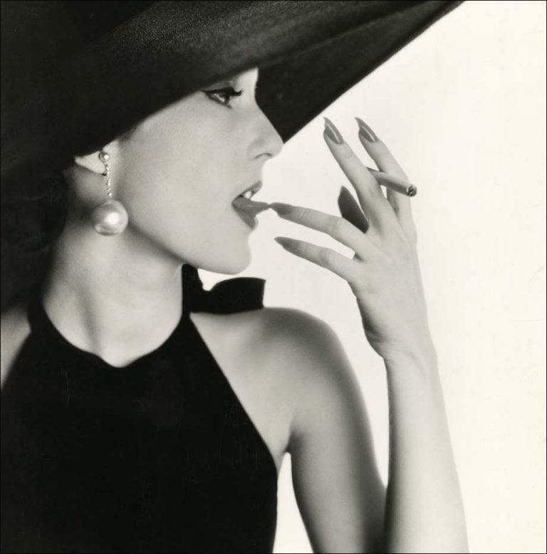 Girl with Tobacco on Tongue (Mary Jane Russell) by Irving Penn