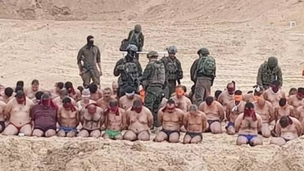 Palestinian men rounded up and stripped by Israeli forces in Gaza before being taken to an undisclosed location