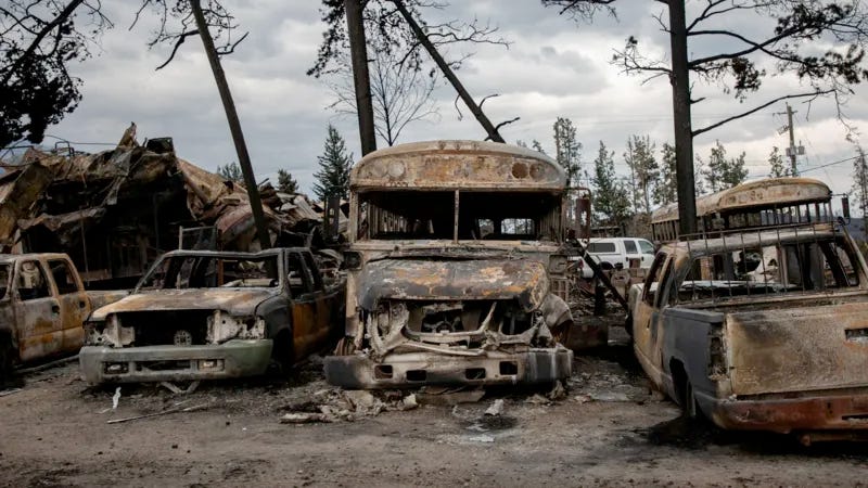 Charred vehicles in the resort town of Jasper, Canada.