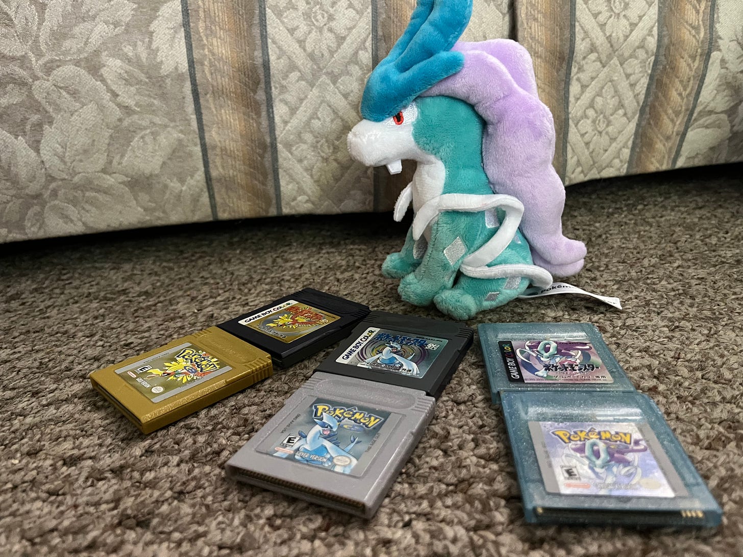 Ayano's awesome Suicune plush, plus her generation 2 games for Game Boy in English and Japanese