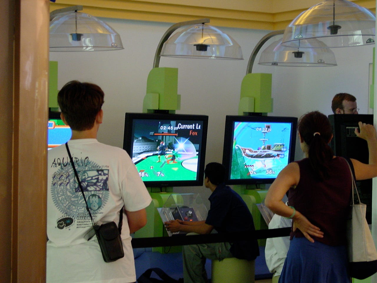 “The Pokémon Trainer Gym”, a dedicated gaming area on the second floor, where children are playing Super Smash Bros. Melee on Nintendo GameCube