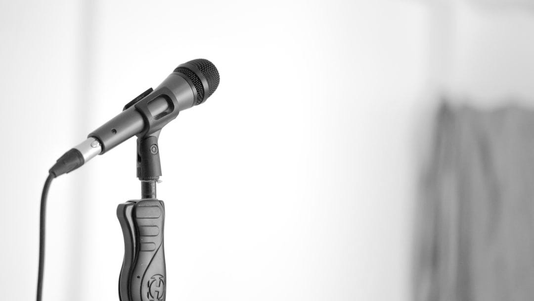 black and gray microphone on white background black and gray microphone on white background