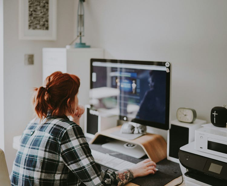 Woman working at Computer in hte workplace