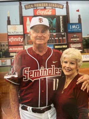 Mike Martin and wife Carol on the field that bears Martin's name at Dick Howser Stadium.