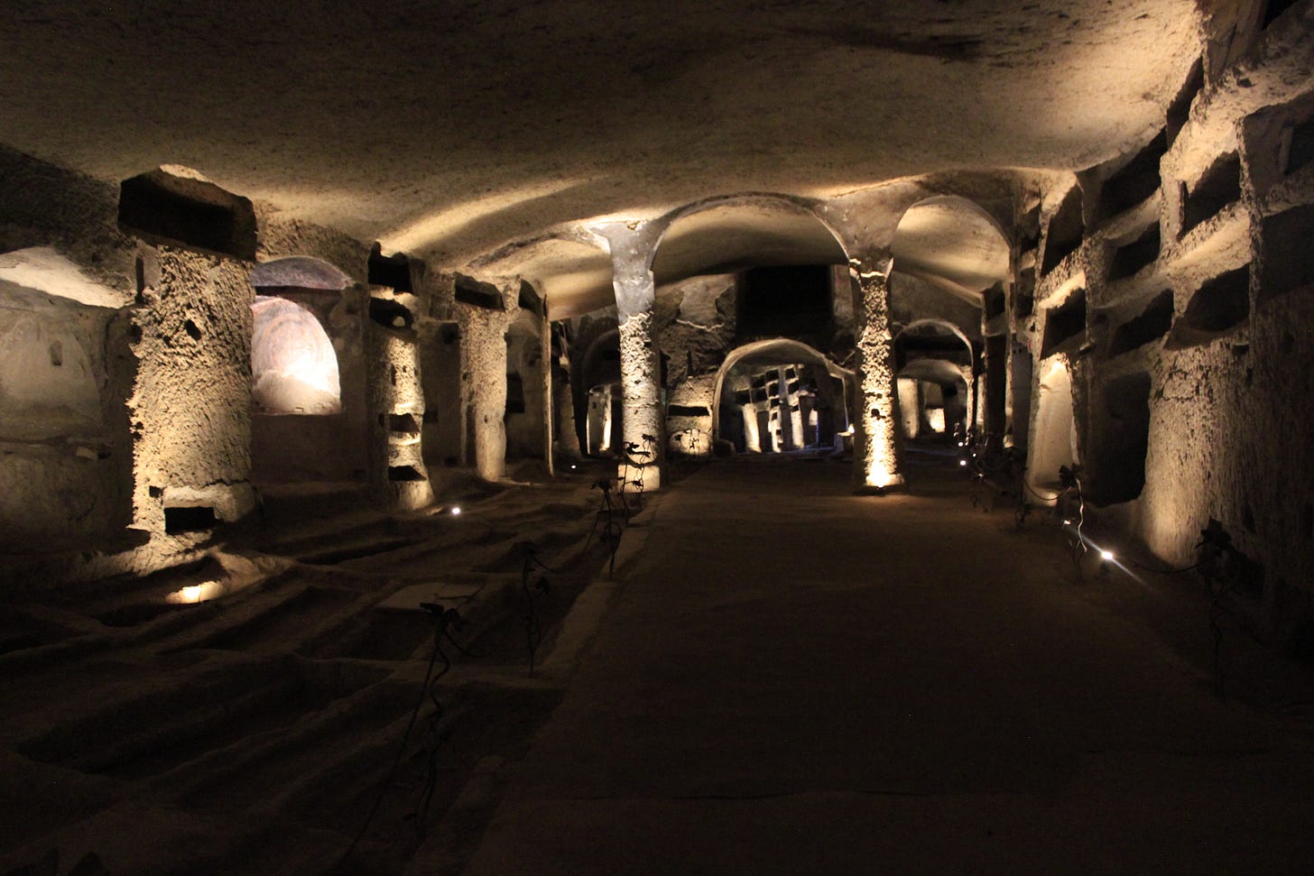Catacombs fo San Gennaro - an underground space with graves dug into the walls.