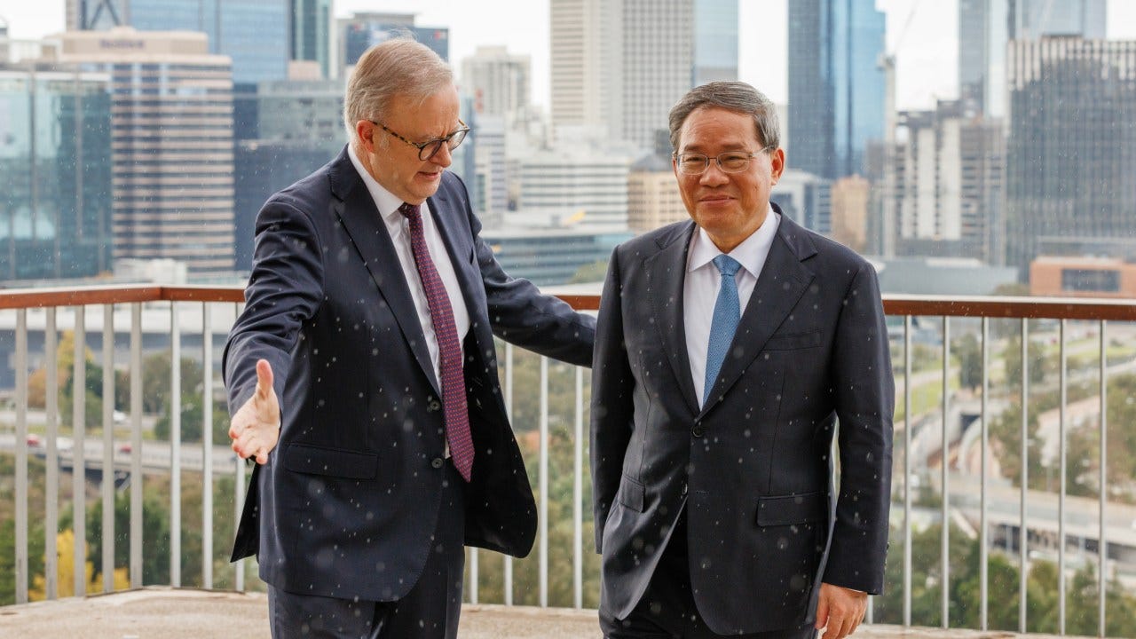 PERTH, AUSTRALIA - JUNE 18: Australian Prime Minister Anthony Albanese and Chinese Premier Li Qiang talk while at the Kaarta Gar-up Lookout in Kings Park before the Australia-China CEO Roundtable on June 18, 2024 in Perth, Australia. Li's visit to Australia aims to strengthen bilateral ties and address outstanding trade and consular issues, including the removal of remaining trade barriers and the release of imprisoned Australian democracy blogger Yang Hengjuno, marking a significant step towards stabilizing the relationship between the two nations. The visit also highlights the growing importance of economic cooperation and the need for dialogue on security concerns, particularly in the context of China's increasing influence in the Pacific region. The visit marks the first high-level diplomatic outreach by a Chinese leader to Australia since 2017. (Photo by Richard Wainwright - Pool/Getty Images) PERTH, AUSTRALIA - JUNE 18: Australian Prime Minister Anthony Albanese and Chinese Premier Li Qiang talk while at the Kaarta Gar-up Lookout in Kings Park before the Australia-China CEO Roundtable on June 18, 2024 in Perth, Australia. Li's visit to Australia aims to strengthen bilateral ties and address outstanding trade and consular issues, including the removal of remaining trade barriers and the release of imprisoned Australian democracy blogger Yang Hengjuno, marking a significant step towards stabilizing the relationship between the two nations. The visit also highlights the growing importance of economic cooperation and the need for dialogue on security concerns, particularly in the context of China's increasing influence in the Pacific region. The visit marks the first high-level diplomatic outreach by a Chinese leader to Australia since 2017. (Photo by Richard Wainwright - Pool/Getty Images)