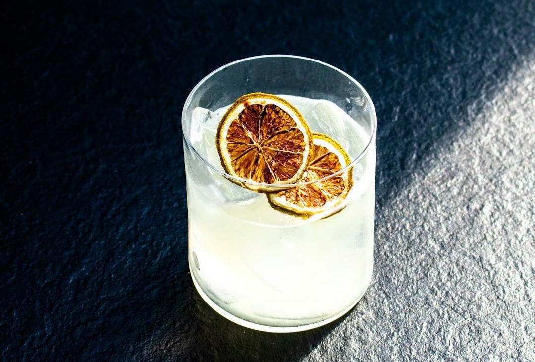 clear drinking glass with white liquid clear drinking glass with white liquid