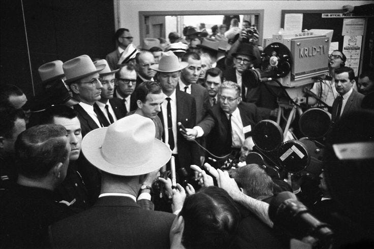 After his arrest, Lee Harvey Oswald faces a crowd of local, national ...