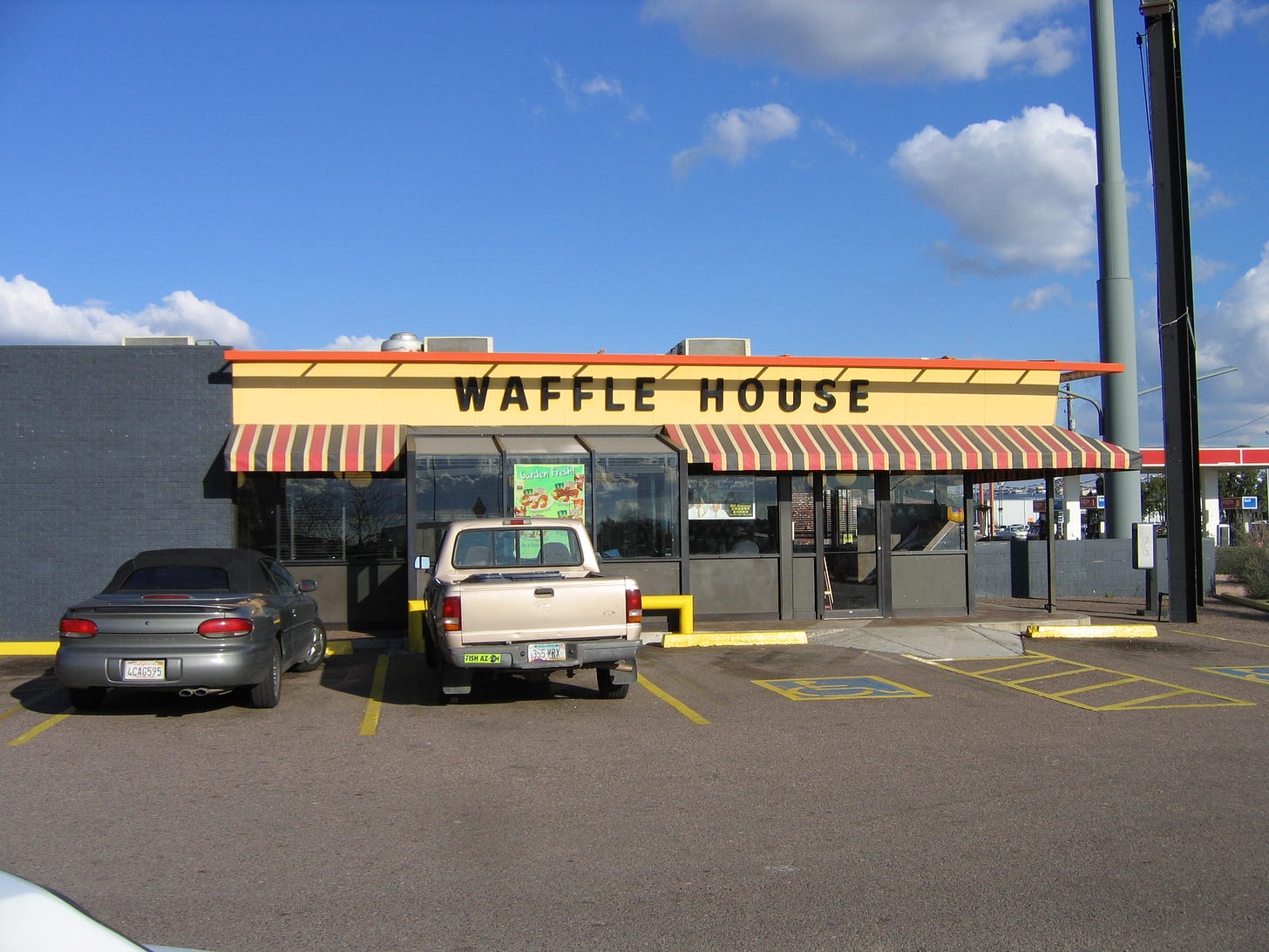 waffle house with cars parked out front