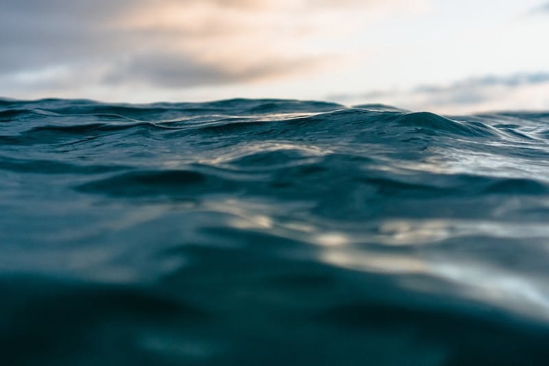 body of water across mountains