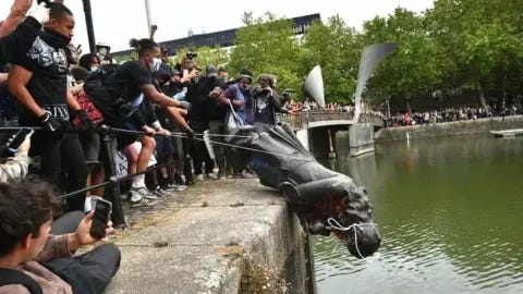 PA Media The statue was thrown into the docks by the crowd