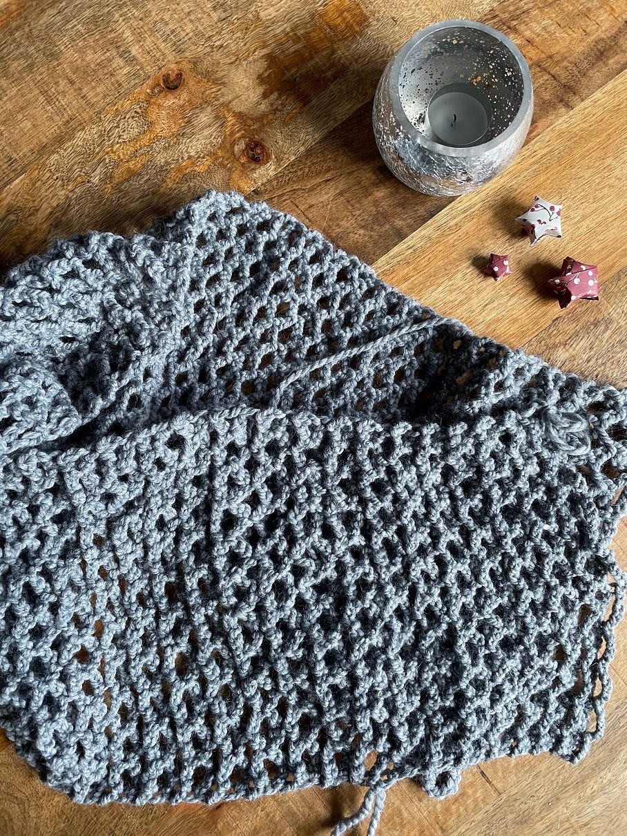 Photo of crocheted scarf in grey yarn