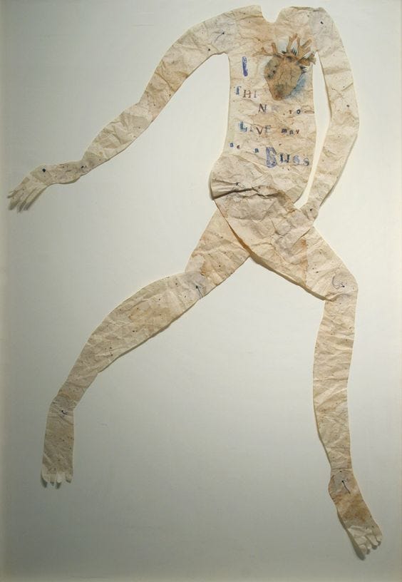 Paper collage of headless body with text