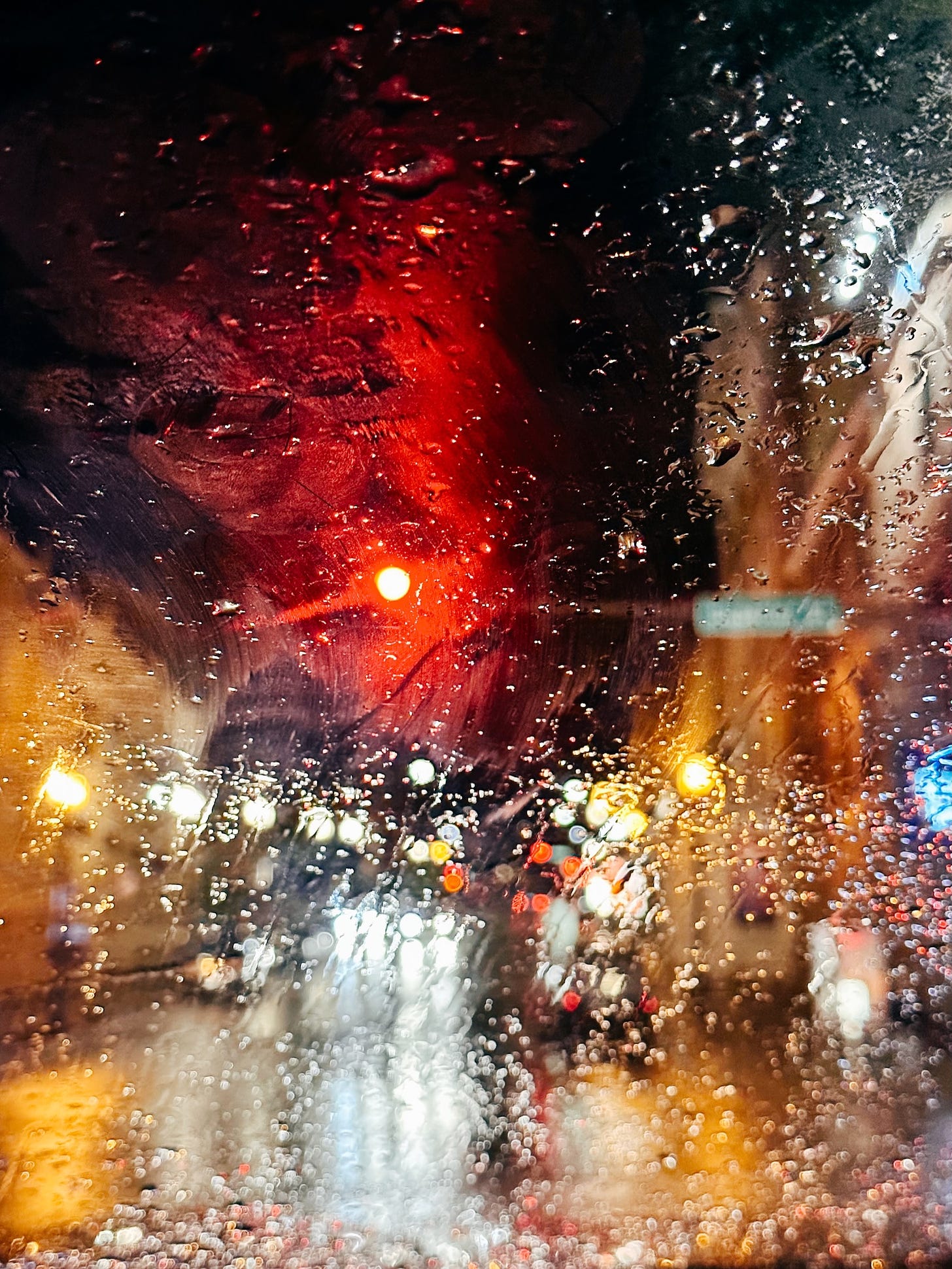 Street lights through a wet window