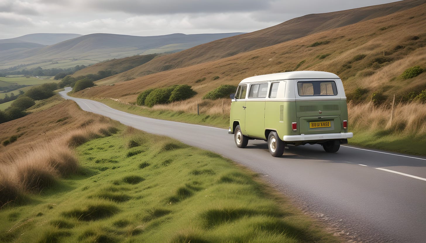 Vintage camper van driving in rural Wales